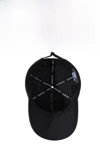Detail view of laser-perforated breathable fabric and internal seam tape on a baseball cap