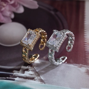 Elegant gold and silver copper rings with rectangular crystals and chain link band