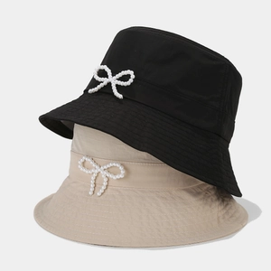 Fashionable quick-dry bucket hat with pearl bow detail in black and beige colors