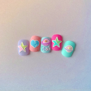 Detail of 5D embossed nail stickers featuring macaron heart and star relief patterns
