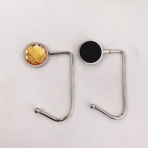 Portable desk hook for bags with yellow crystal and black round metal finish