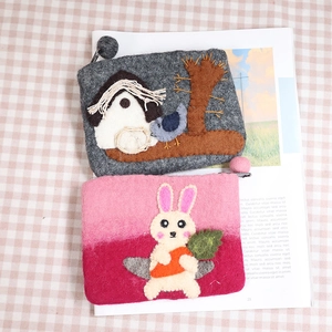Handmade wool felt coin purses featuring cute rabbit and bird house designs on plaid cloth