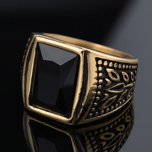 Vintage men's stainless steel ring featuring a large rectangular black gemstone and relief