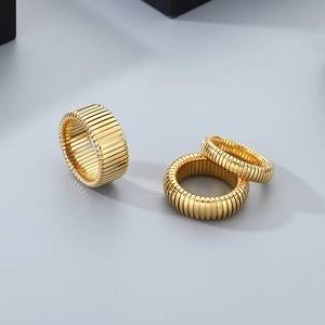 Fashionable golden stainless steel coiled snake ring with ribbed texture for couples