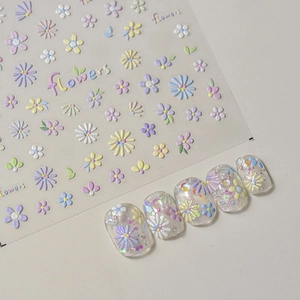 Macro detail of 3D embossed colorful flower nail art stickers with sample nail display