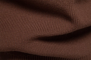Close-up of premium dark brown knit fabric texture showing high-quality business sweater detail