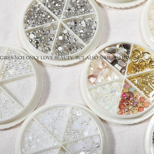 Assorted nail art decoration kit with pearls, rhinestones, and gems in six-grid cases