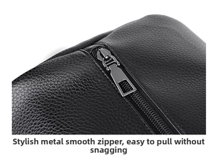 Detail of silver smooth metal zipper on black lychee pattern leather sports bag