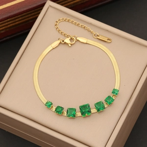 Golden emerald square necklace with stainless steel chain in a beige jewelry box