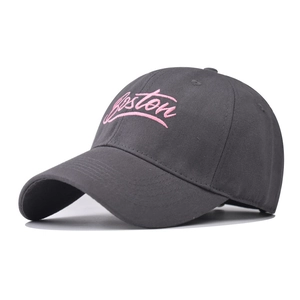 Close-up of Boston embroidery on dark gray cotton twill baseball cap with pink stitching