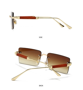 Detailansicht der randlosen Sonnenbrille mit braunen Verlaufsgläsern und Holzmaserung