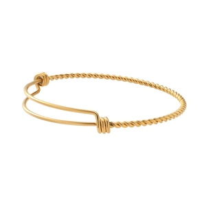 Detail view of golden twisted cable stainless steel bangle with adjustable structure