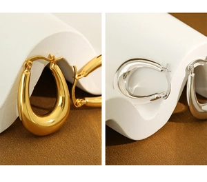 Close-up showing S925 hallmark on gold and silver oval sterling silver earrings