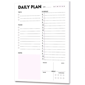 Close-up of minimalist daily planner page with time schedule and task lists