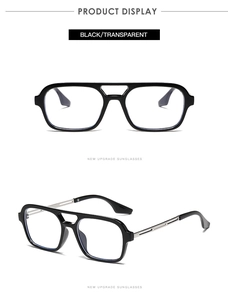 Close-up of retro double-bridge eyewear with black frame and silver metal temples