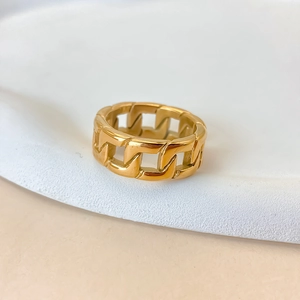 Detailed macro shot of the hollow woven Cuban chain ring in polished gold finish