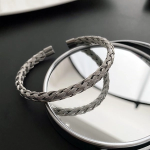 Minimalist woven titanium steel open bangle with silver metallic luster for women