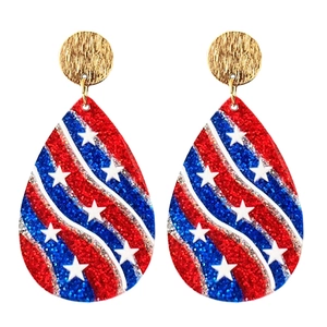 Close-up of teardrop earrings featuring red white and blue glitter and stars stripes