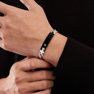 Polished silver stainless steel men's bracelet with black rectangular cross plate