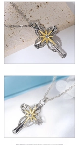 Detailed close-up of a two-tone cross and star pendant with sparkling pavé stones