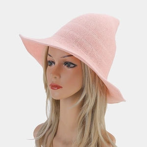 Detail of pink knitted witch hat showing high-quality mesh texture and wide brim