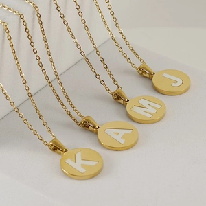 Gold 18K stainless steel necklaces with round white letter pendants J, M, A, and K