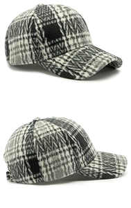 Detailed view of plaid wool baseball cap with adjustable metal buckle and thick fabric texture