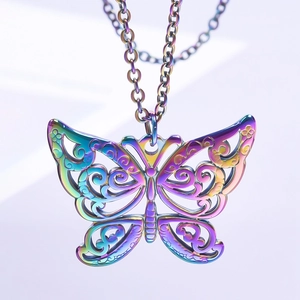 Macro detail of iridescent butterfly pendant necklace with hollow pattern on purple gradient