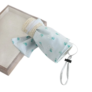 Girls foldable sun visor with light blue floral pattern, lace edges and adjustable strap