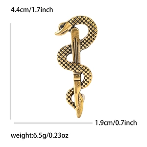 Detail of golden alloy snake caduceus brooch with size dimensions in inches and cm