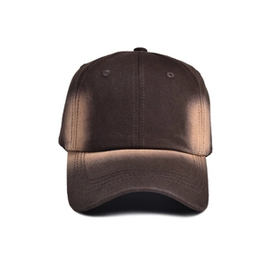 Detail of vintage tie-dye baseball cap showing cotton canvas texture and gradient brown finish