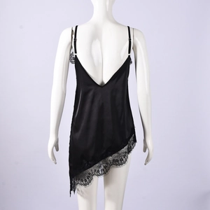 Detail of black satin camisole featuring asymmetrical lace hem and adjustable straps