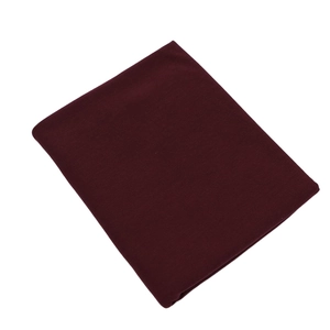 Detailed view of folded dark red mercerized cotton jersey fabric with soft texture