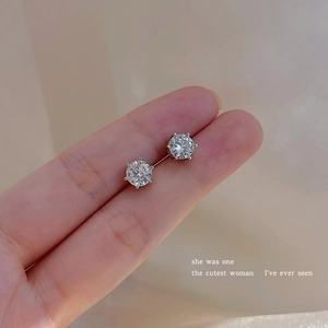 Close-up of sparkling round-cut cubic zirconia stud earrings in a classic six-prong setting