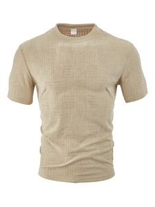 Macro detail of the textured waffle fabric and the M size label on the beige polo shirt