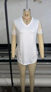 Detail of white V-neck t-shirt featuring elegant lace short sleeves for women