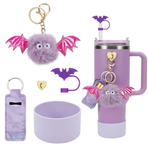 Close-up of purple Christmas theme accessories including bat straw cap and silicone boot