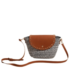 Fashionable black and white woven straw crossbody bag with brown leather flap and studs