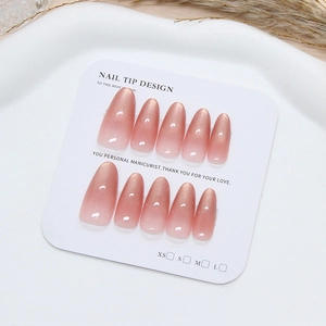 Handmade pink rose cat eye almond press-on nails with elegant gradient finish on a display card