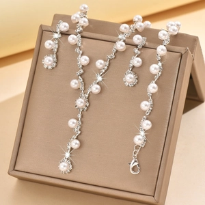 Elegant pearl and rhinestone jewelry set with Y-shaped necklace and matching earrings