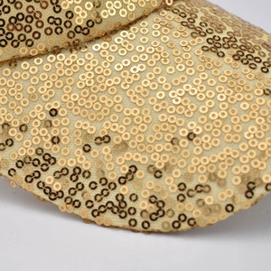 Macro shot of shimmering gold sequins on a stylish breathable mesh cap detail