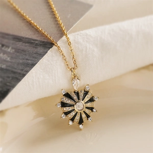 Gold plated heart pendant necklace with black enamel and sparkling zircon stones
