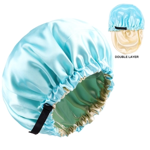Close-up of double-layer satin bonnet in light blue and beige with adjustable strap