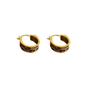 Vintage gold-plated C-shaped hoop earrings with leopard print enamel and orange crystals