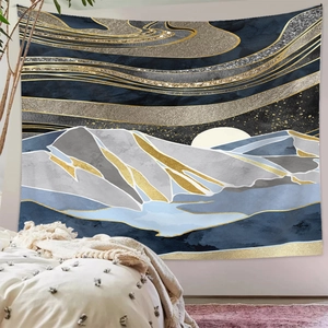 Detail of mountain tapestry with abstract gold lines hanging in a cozy bedroom