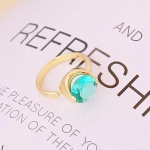 Minimalist open adjustable gold ring with faceted lake blue zircon and claw setting