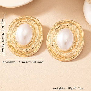 Detail showing dimensions of vintage gold round earrings with hammered texture and pearl