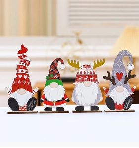 Detail of four wooden Christmas gnomes featuring Merry Christmas and Welcome signs