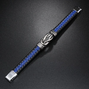 Detailed macro view of woven leather bracelet with silver infinity symbol and magnetic clasp