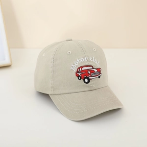 Detail of embroidered Motor Club text and red retro car on beige washed baseball cap